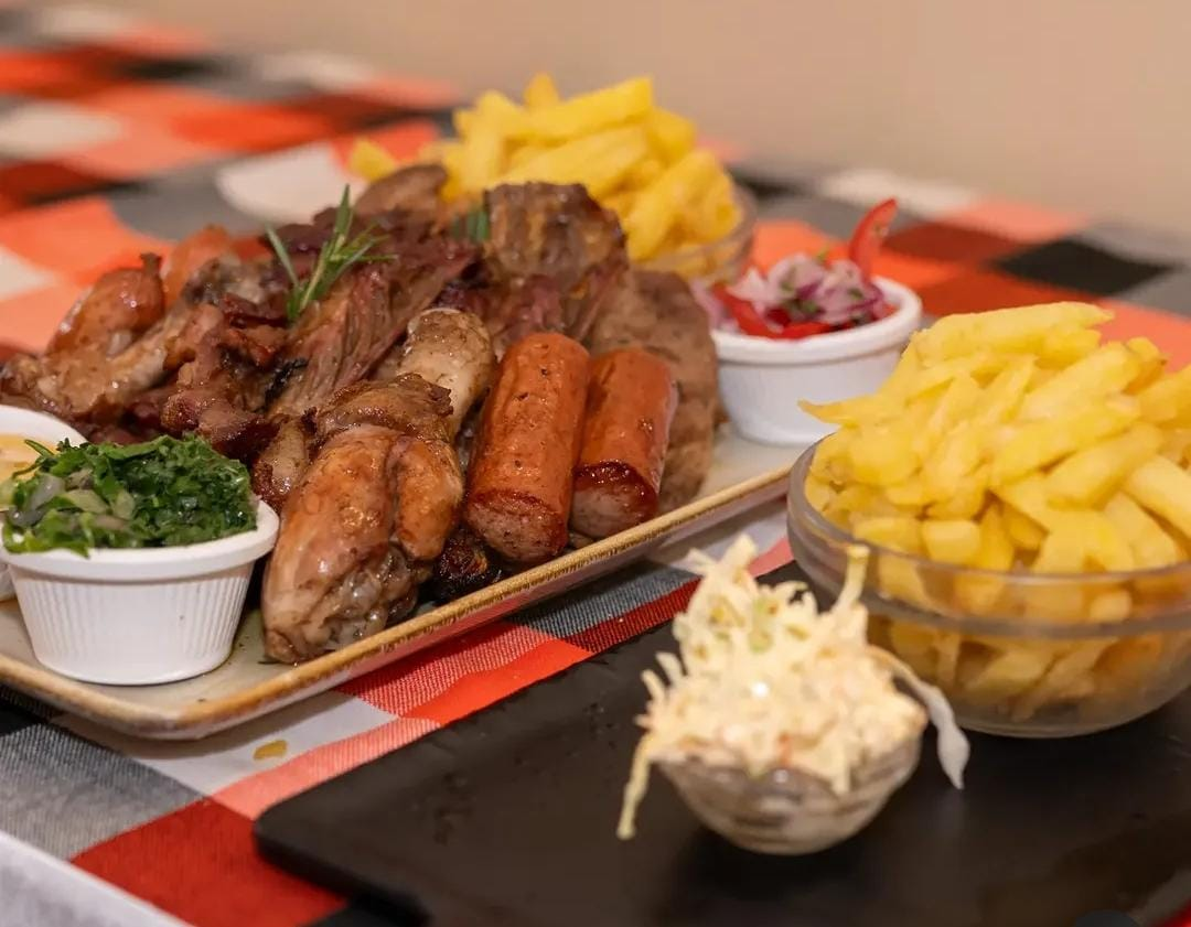 Mixed grill platter with fries, kachumbari and coleslaw
